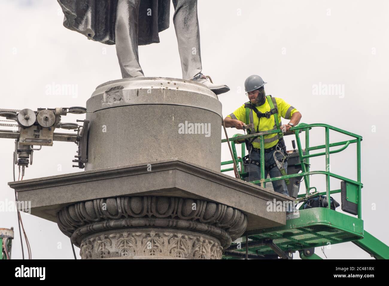 Charleston, United States. 24th June, 2020. Workers operate a stone saw