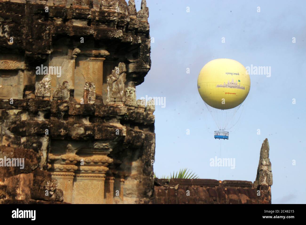 Angkor Wat, Siem Reap, Cambodia - Sep 05, 2017 : low level flight Hot Air Balloon for tourist. Angkor Wat tower as foreground. Stock Photo