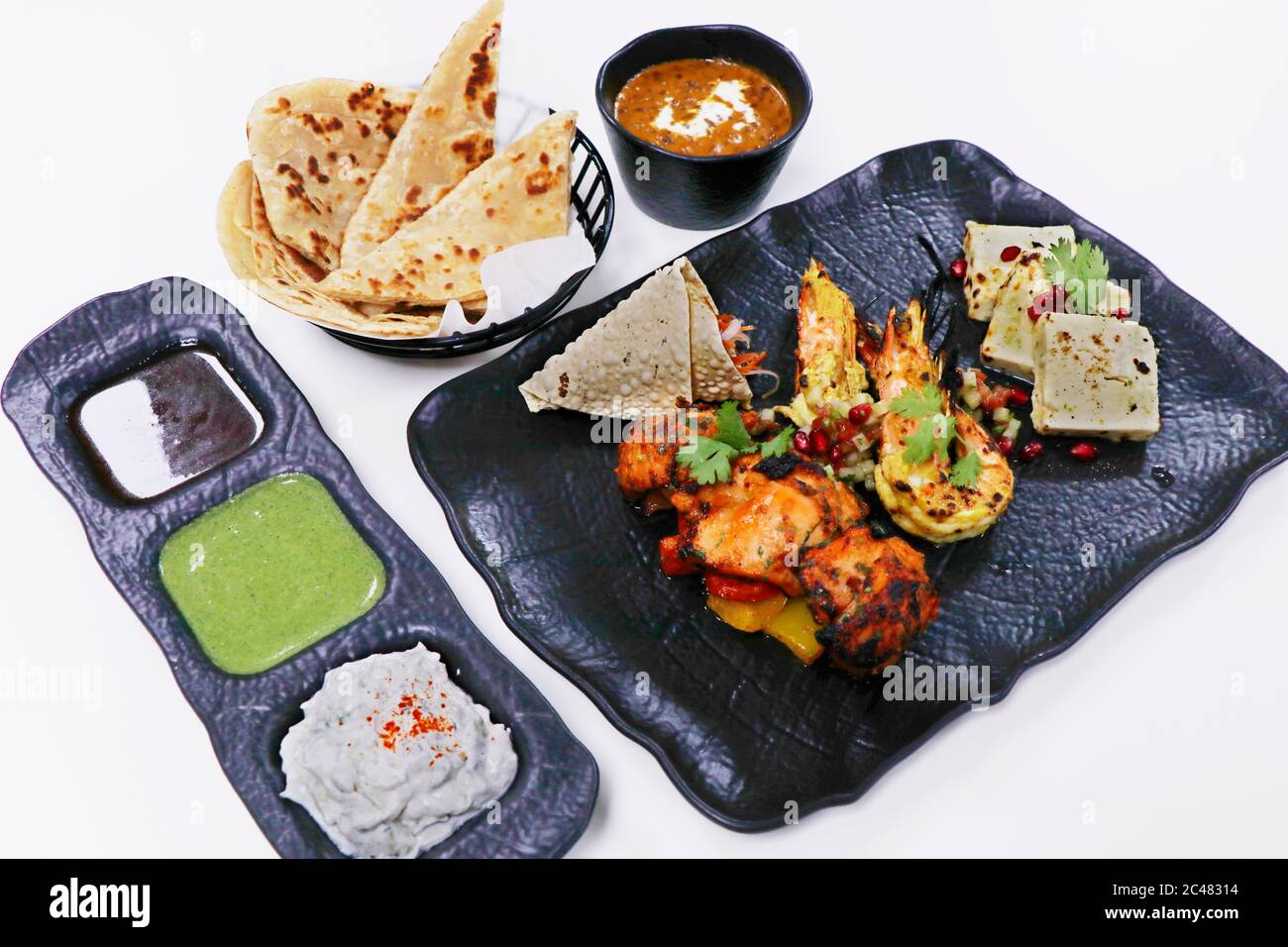 tandoori platter with chicken tikka, grilled prawns, and paneer along