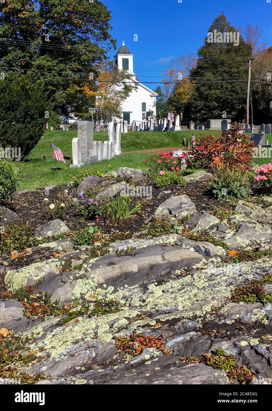Oldest New England white wooden country church and cemetery in Kittery in autumn. One of the oldest churches in Maine. First Congregational church. Stock Photo
