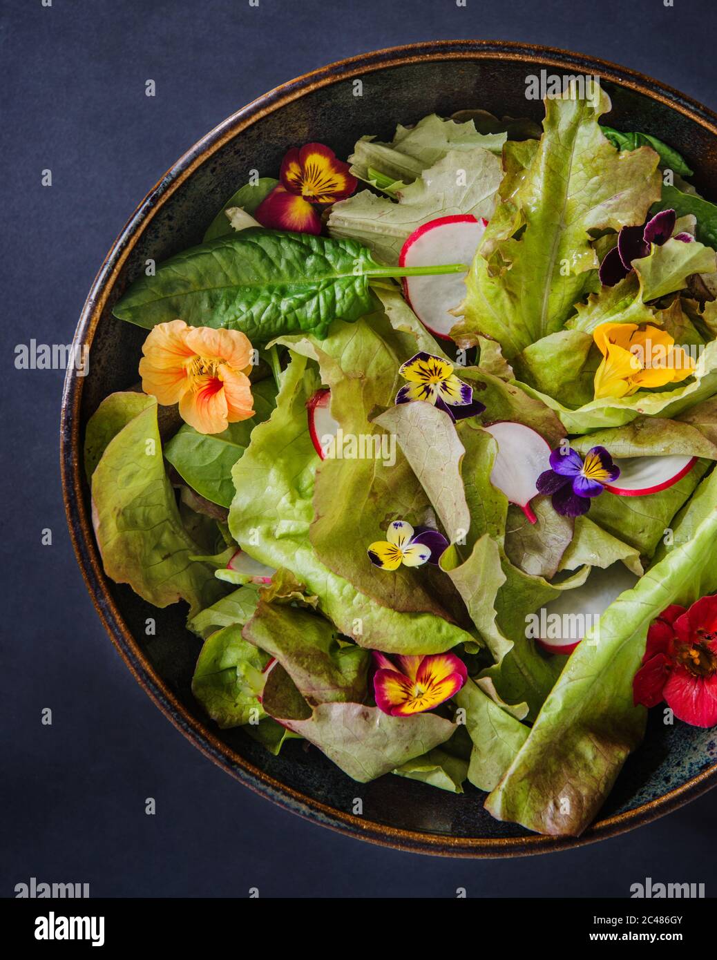 Spring salad leaves with edible flowers Stock Photo Alamy