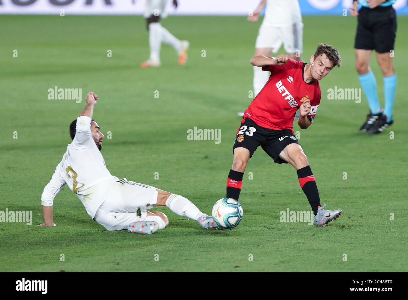 Madrid, Spain. 24th June, 2020. Real Madrid's Carvajal (L) vies with Mallorca's Aleix Febas during a Spanish league football match between Real Madrid and Mallorca in Madrid, Spain, June 24, 2020. Credit: Edward F. Peters/Xinhua/Alamy Live News Stock Photo