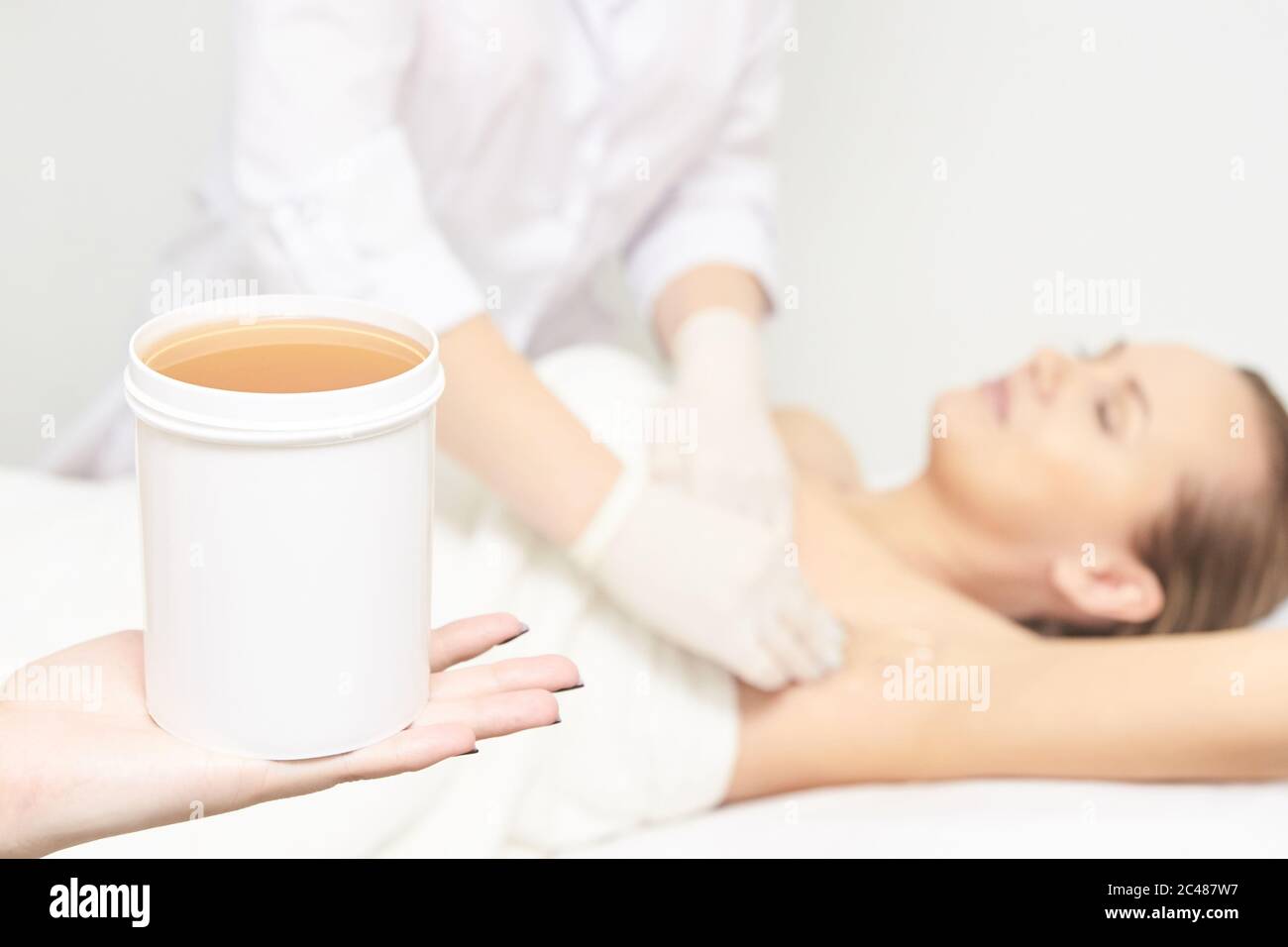 Sugar hair removal from woman body. Wax epilation spa procedure. Procedure beautician female. Armpit Stock Photo - Alamy Sugar hair removal from woman body. Wax epilation spa procedure. Procedure beautician female. Armpit Stock Photo - Alamy