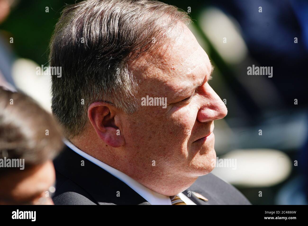 US Secretary of State Mike Pompeo listens as US President Donald J. Trump and Polish President Andrzej Duda hold a joint press conference in the Rose Garden of the White House in Washington, DC, USA, 24 June 2020. Duda, a conservative nationalist facing a tight re-election race back home, is the first foreign leader to visit the White House in more than three months.Credit: Jim LoScalzo/Pool via CNP /MediaPunch Stock Photo