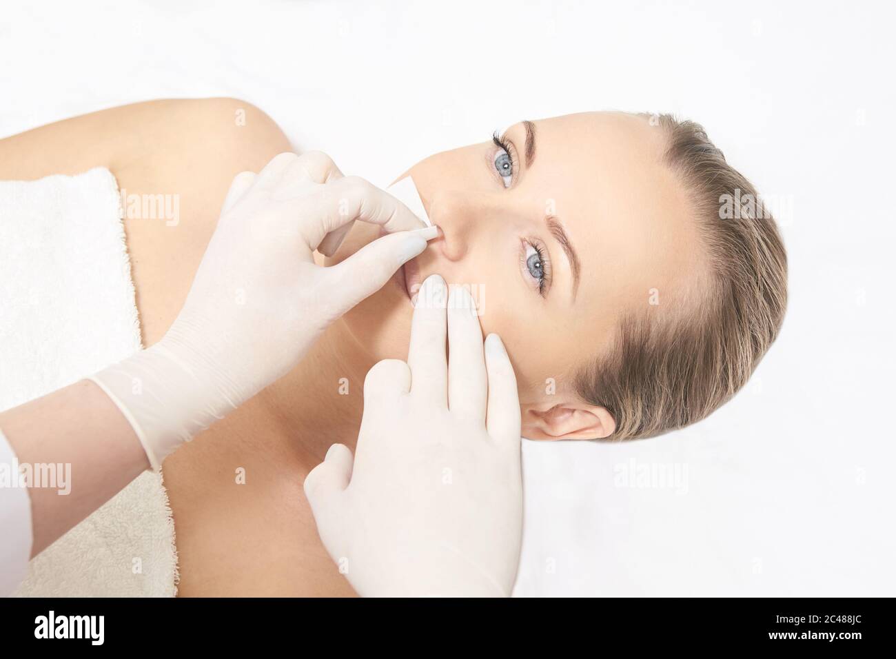 Sugar hair removal from woman body. Wax epilation spa procedure