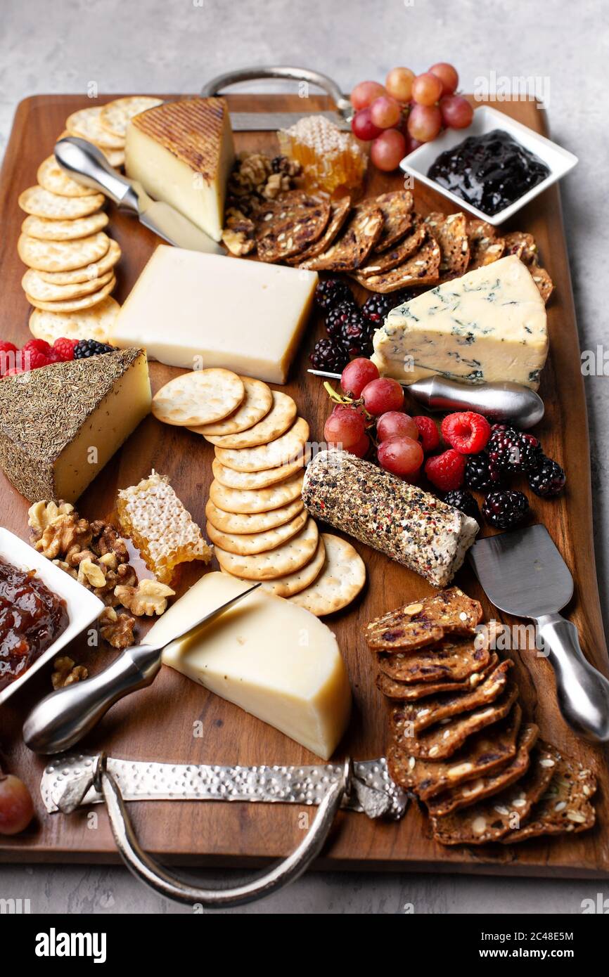 Cheese board with honey and crackers Stock Photo Alamy