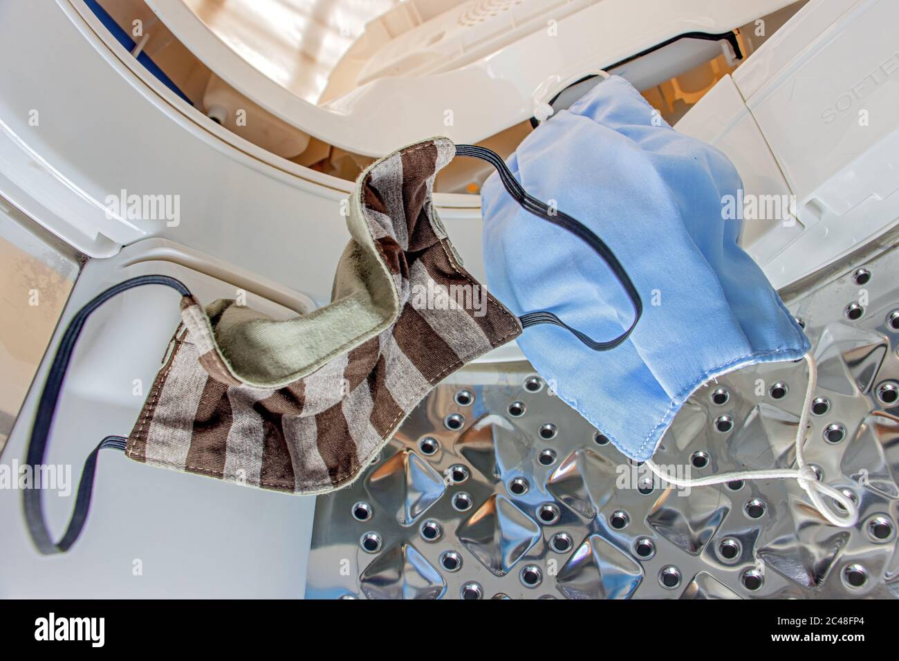 Face masks fall into the washing machine. Cleaning and disinfection of