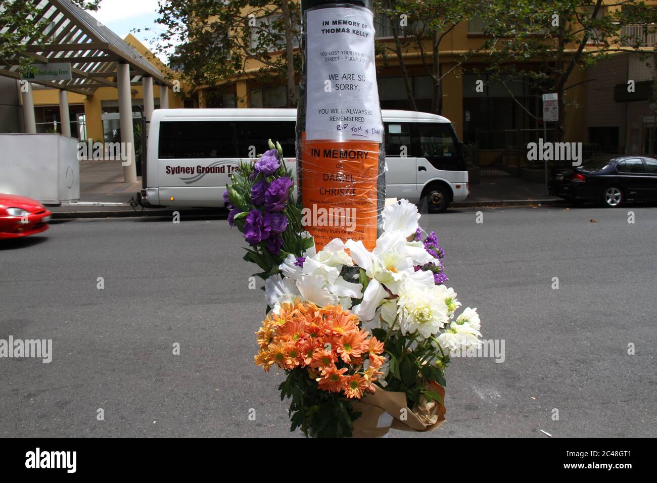 Flowers tied to a lamppost on Victoria Street, Kings Cross in memory of ...