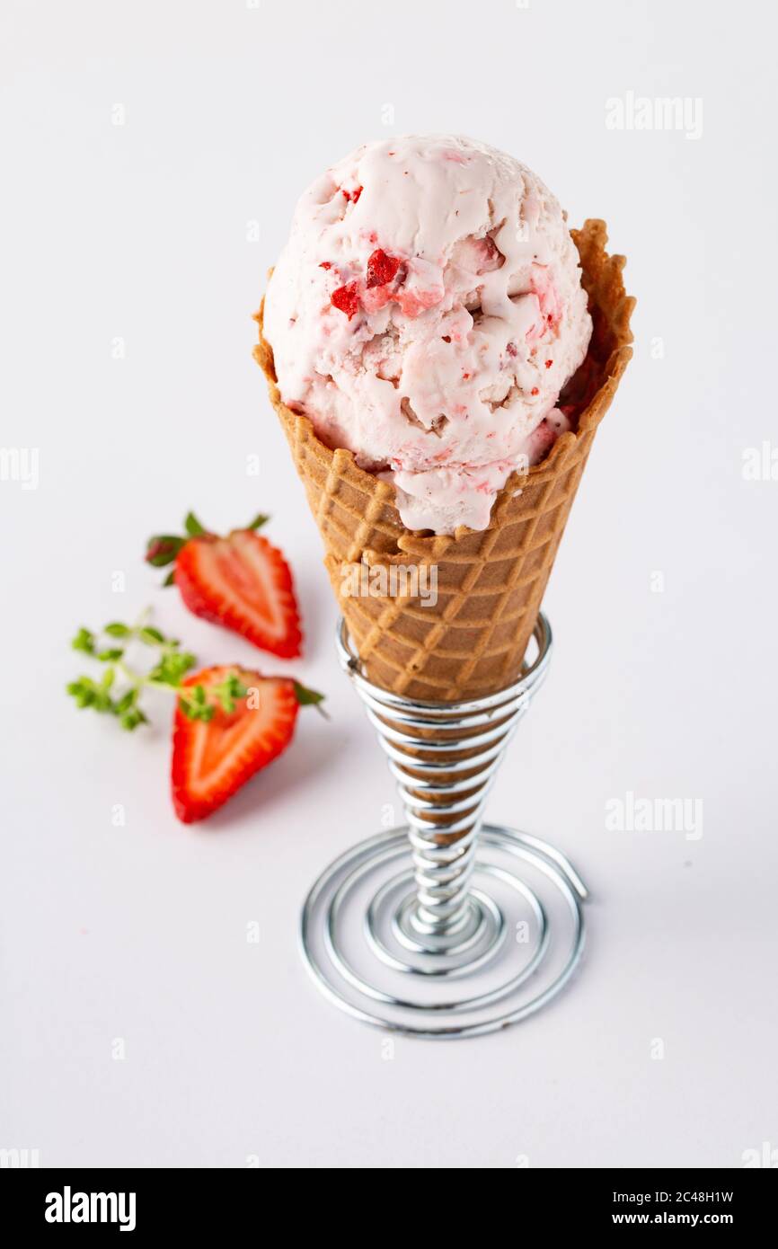 Strawberry ice cream in waffle cone Stock Photo - Alamy