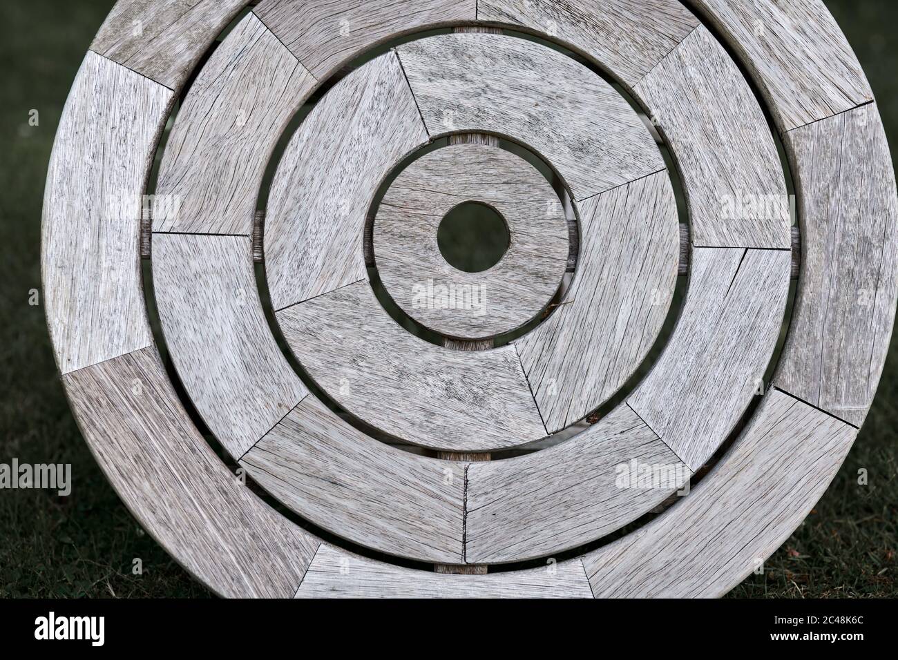 Concentric circles on an iroko wood garden table top. Stock Photo