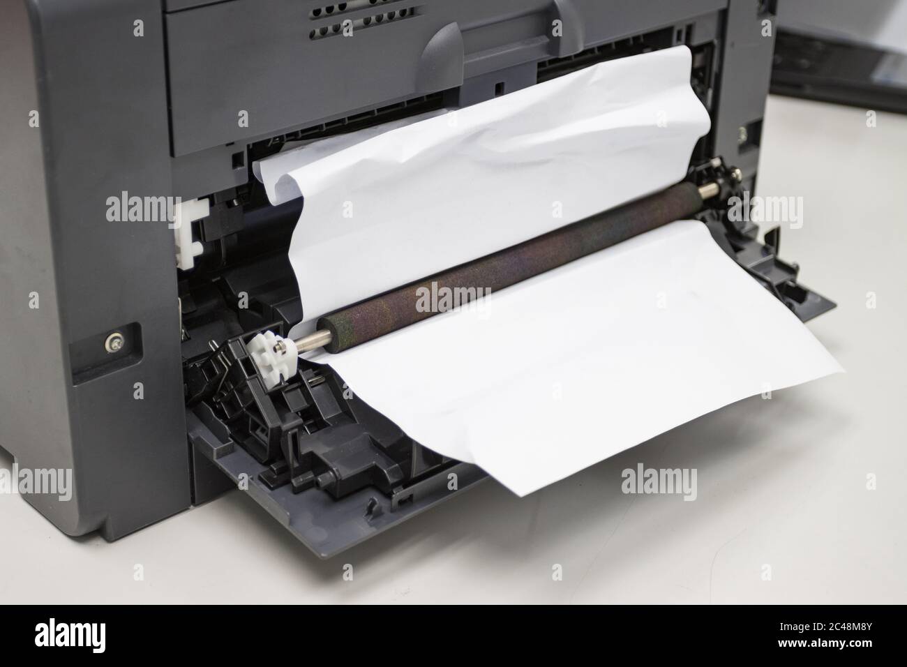 Paper A4 Stuck In Printer At Office, concept repair printer Stock Photo