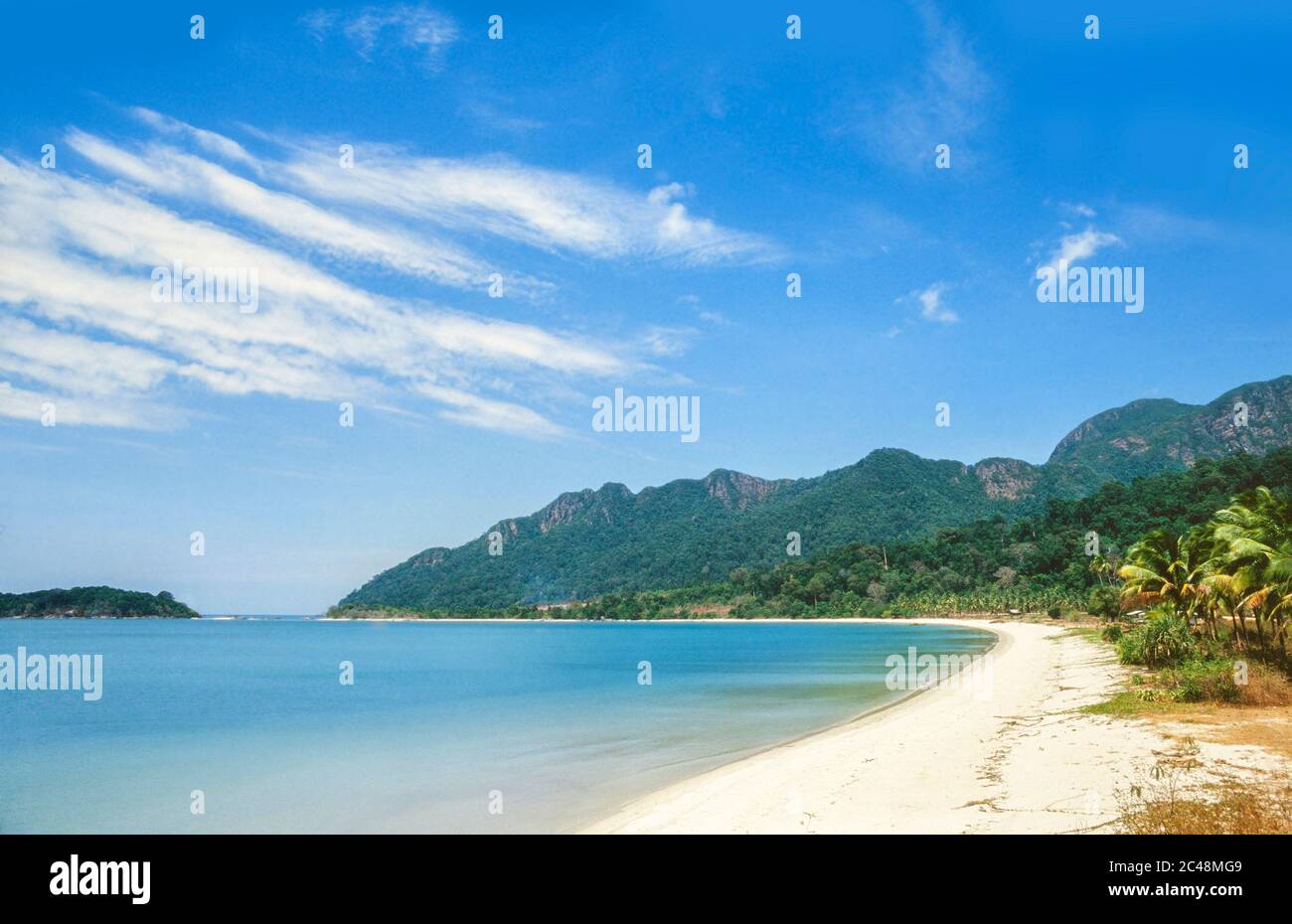 Tropical beach scene, Malaysia, bright sun, white sand, empty beach Stock Photo