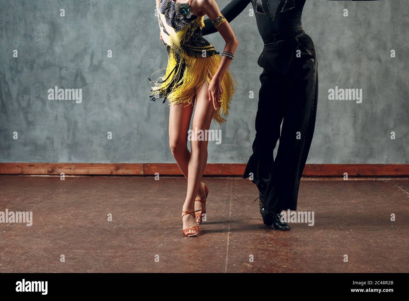 Ballroom dancing. Young couple ballroom dancers. Samba dance Stock Photo