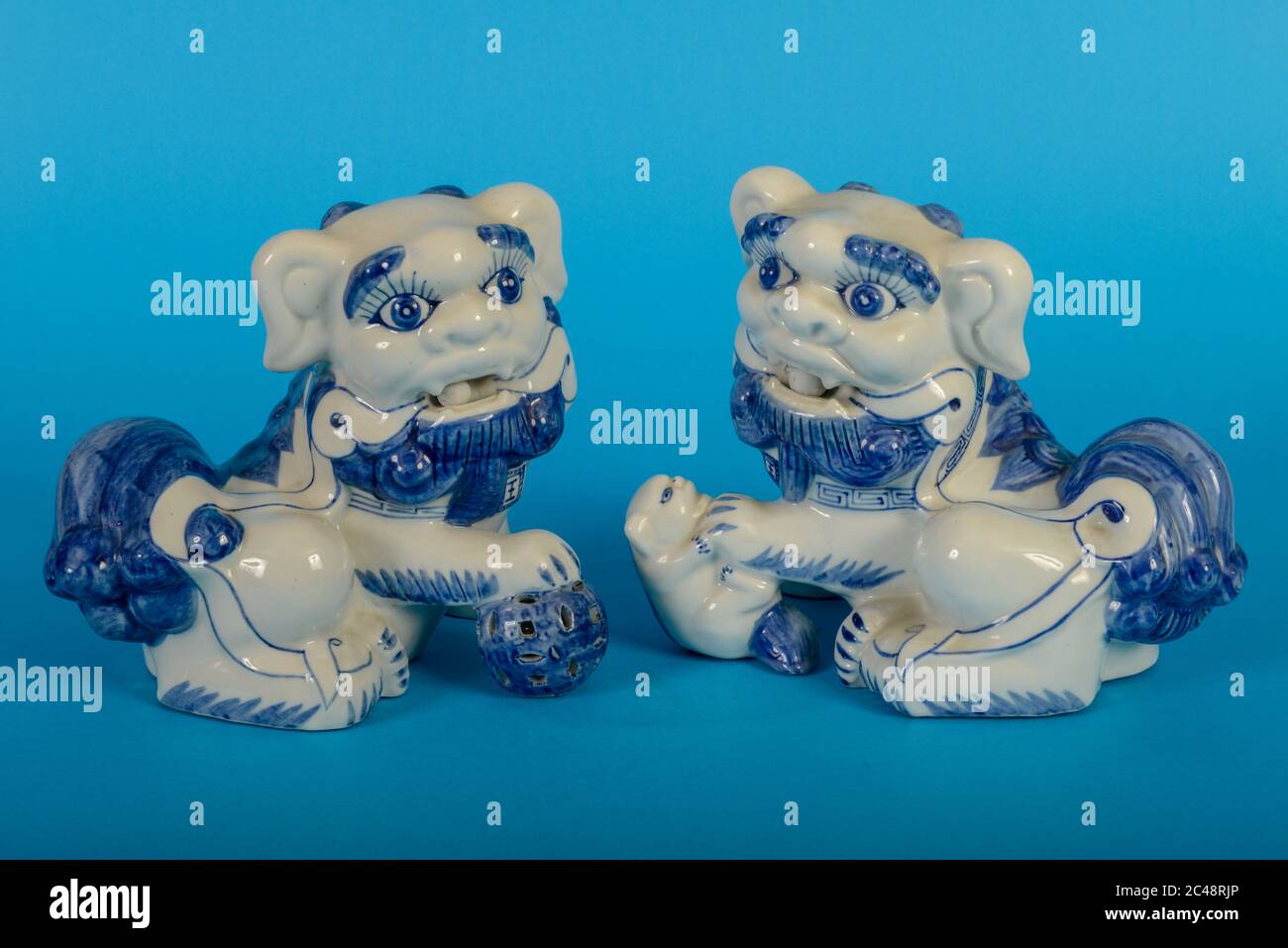 Chinese lion dogs statue on blue background Stock Photo