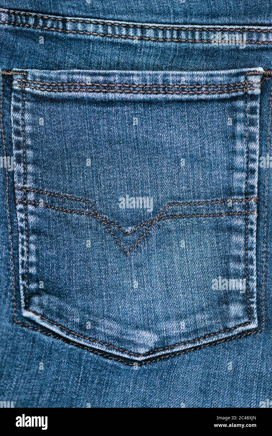 close view of  blue denim stone washed rear jean pocket Stock Photo