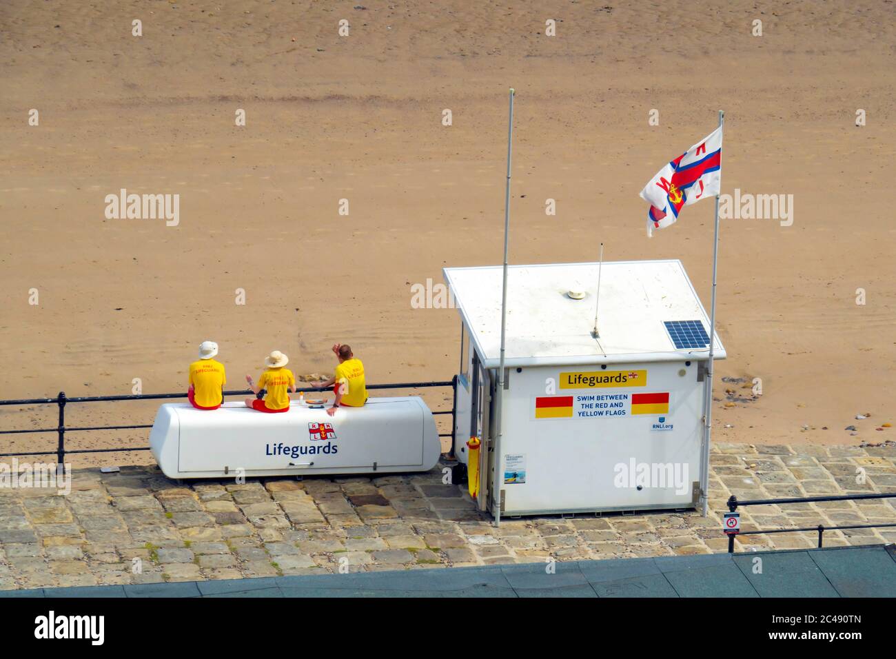 RNLI Lifeguards on duty at Saltburn North Yorkshire on 22 June 2020 the first time since the start of the Pandemic Lockdown Stock Photo