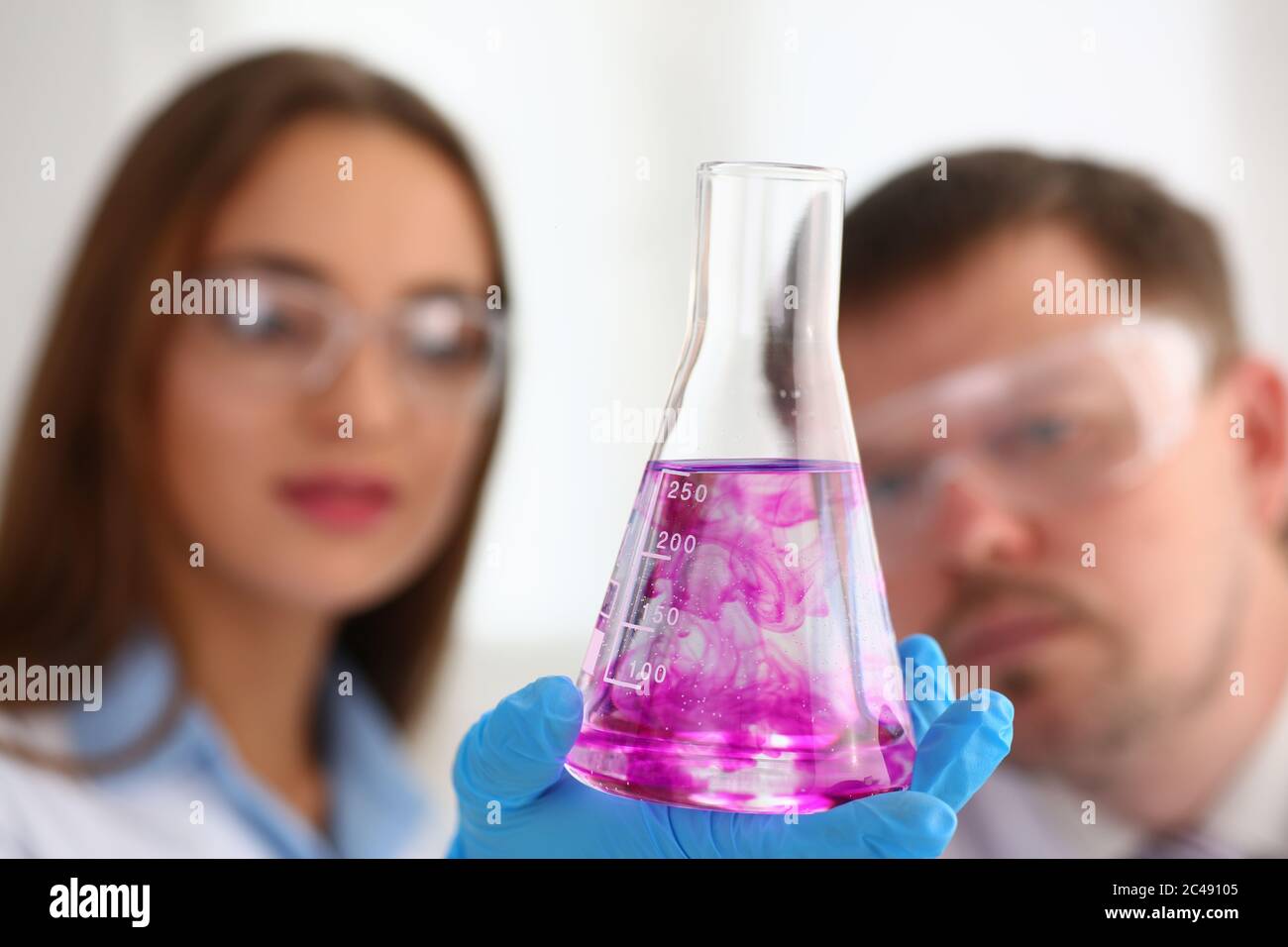 Medical workers doing laboratory test and studying vaccine Stock Photo