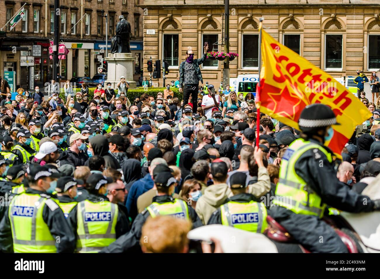 Police kettle a section of protesters at "Stand up to racism" protest
