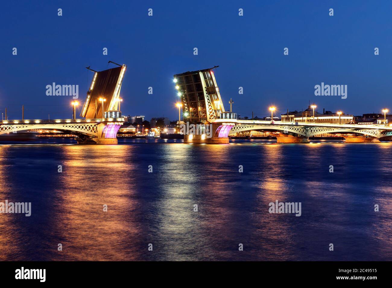 Blagoveschchenskiy Bridge over the Neva River in Saint Petersburg in it's open position to allow ships to enter the city during the white nights of Ju Stock Photo