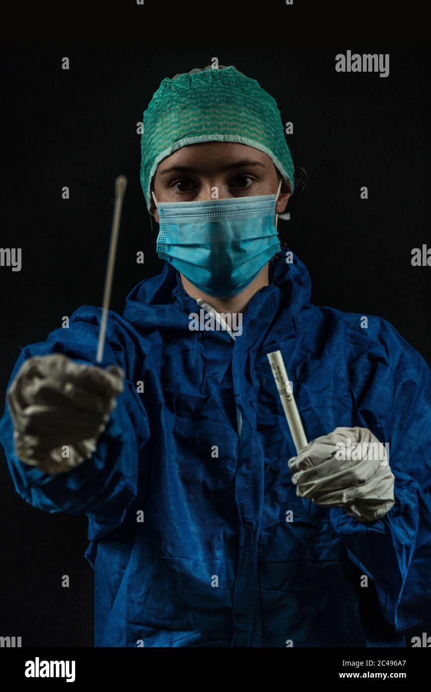 Doomsday style photo of Medical technician about to administer a swab test Stock Photo