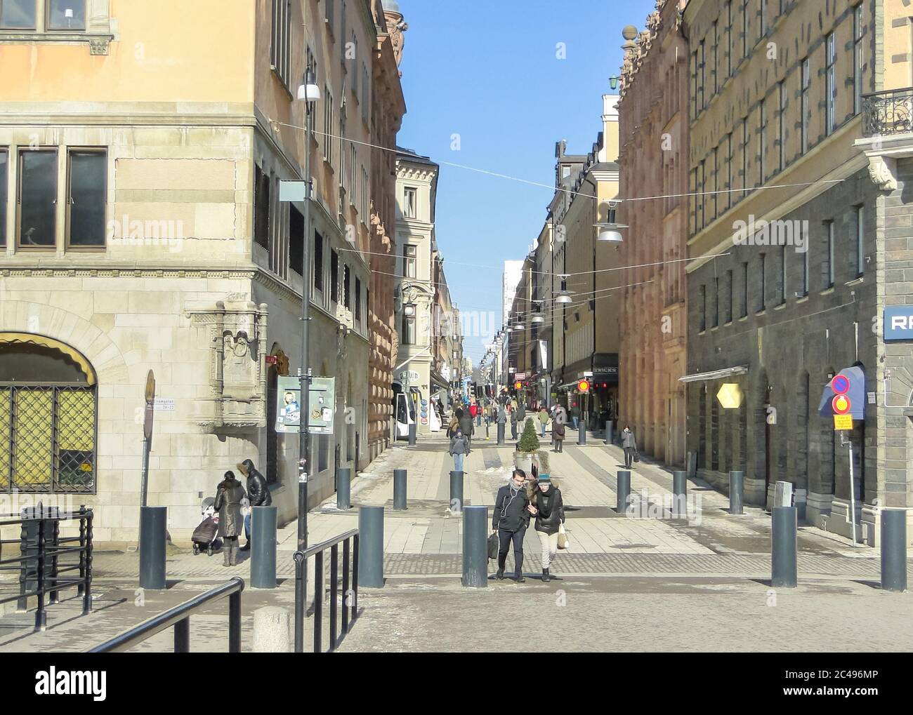 View of Drottninggatan street in spring. One of the central streets of Stockholm, full of shops and restaurants. Sunny day. Stock Photo