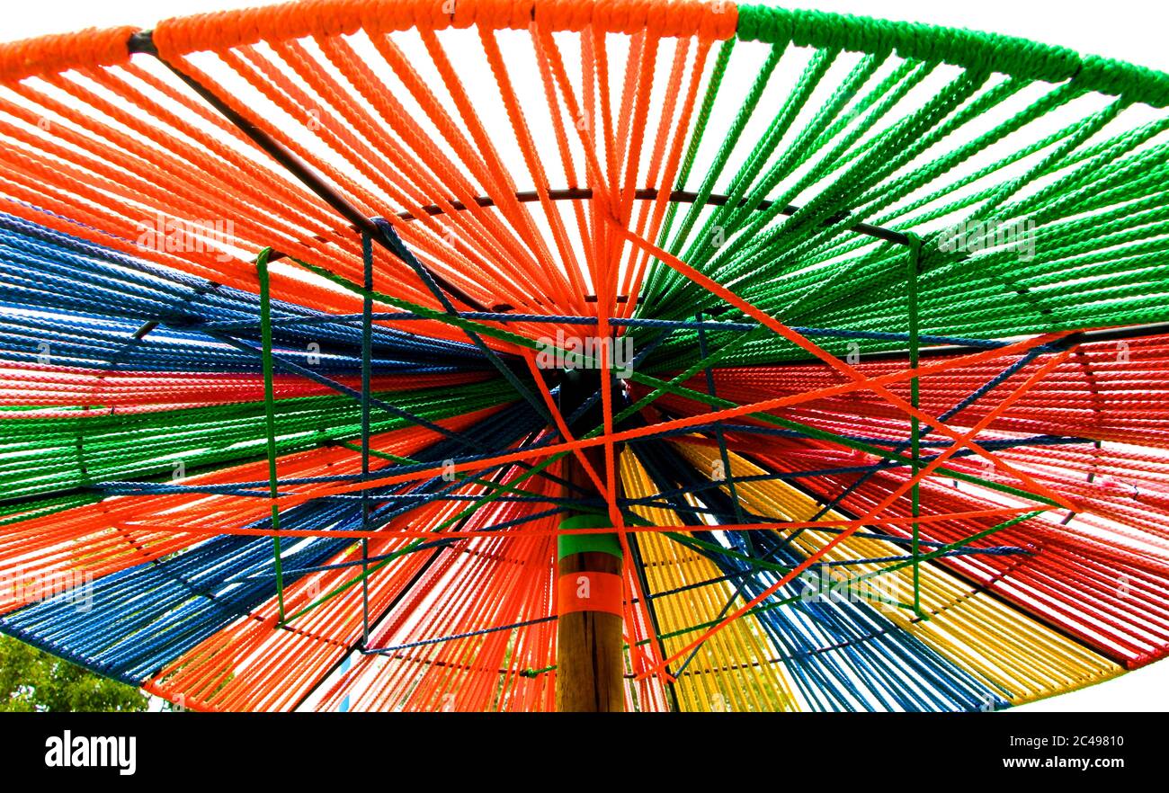 Colourful parasol shade umbrella made from coloured string rope Madrid  Spain Stock Photo - Alamy