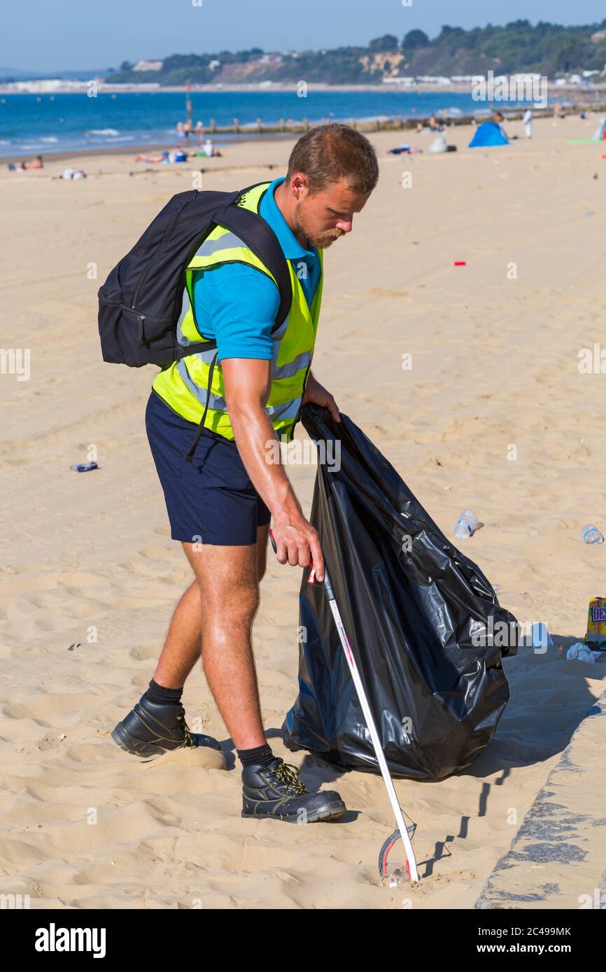 Bournemouth, Dorset UK. 25th June 2020. UK weather: morning after the day before shows the aftermath of packed beaches at Bournemouth as a result of the heatwave with litter everywhere and tents on the beaches. The BCP council try to keep on top of it and council workers ae out picking up litter from the beaches, but with another hot day it will probably be more of the same with crowds flocking to the beaches despite a plea from the council for visitors to stay away as social distancing is a problem with beaches so busy. Credit: Carolyn Jenkins/Alamy Live News Stock Photo