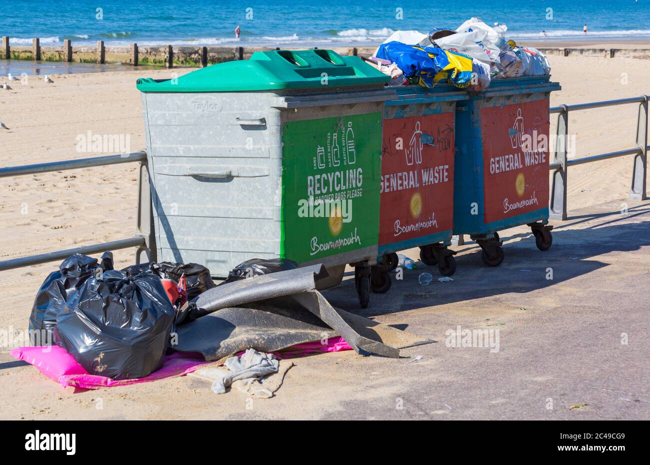 Bournemouth, Dorset UK. 25th June 2020. UK weather: morning after the day before shows the aftermath of packed busy beaches at Bournemouth as a result of the heatwave with litter everywhere and tents on the beaches. The BCP council try to keep on top of it and council workers are out picking up litter from the beaches, but with another hot day it will probably be more of the same with crowds flocking to the beaches despite a plea from the council for visitors to stay away as social distancing is a problem with beaches so busy. Credit: Carolyn Jenkins/Alamy Live News Stock Photo