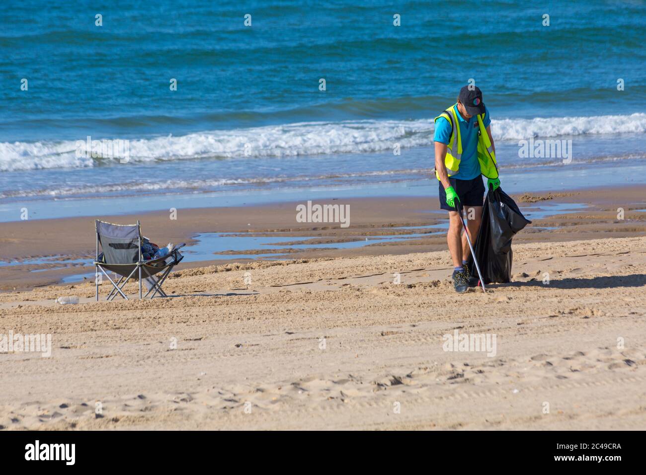 Bournemouth, Dorset UK. 25th June 2020. UK weather: morning after the day before shows the aftermath of packed beaches at Bournemouth as a result of the heatwave with litter everywhere and tents on the beaches. The BCP council try to keep on top of it and council workers ae out picking up litter from the beaches, but with another hot day it will probably be more of the same with crowds flocking to the beaches despite a plea from the council for visitors to stay away as social distancing is a problem with beaches so busy. Credit: Carolyn Jenkins/Alamy Live News Stock Photo