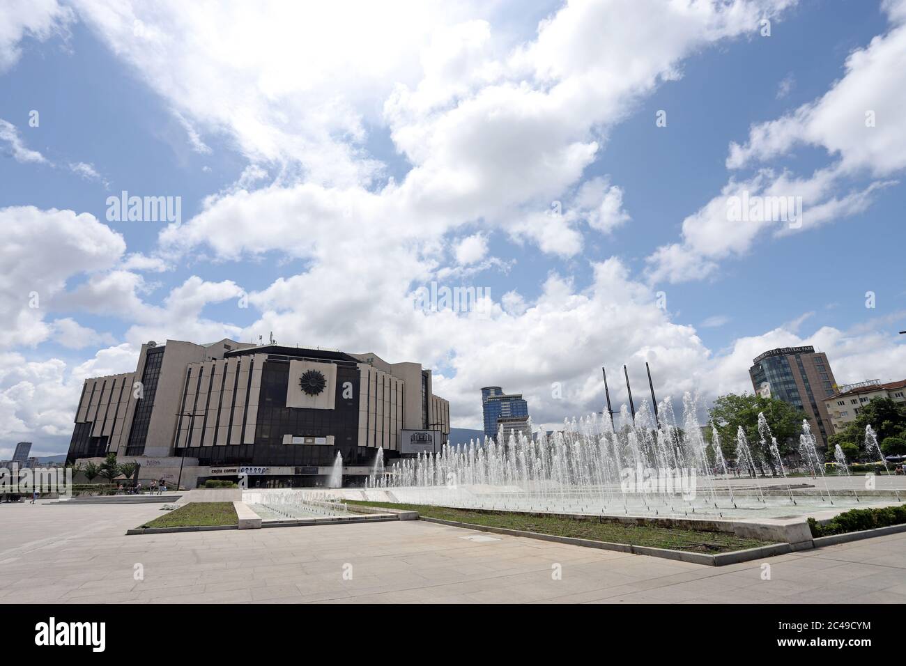 National palace of culture ( NDK ) with fountains in front , with blue sky and clouds, in Sofia, Bulgaria on june 22, 2020 Stock Photo