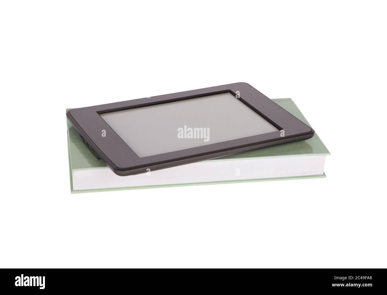 Ebook reader tablet with blank screen and a green paper book. Isolated