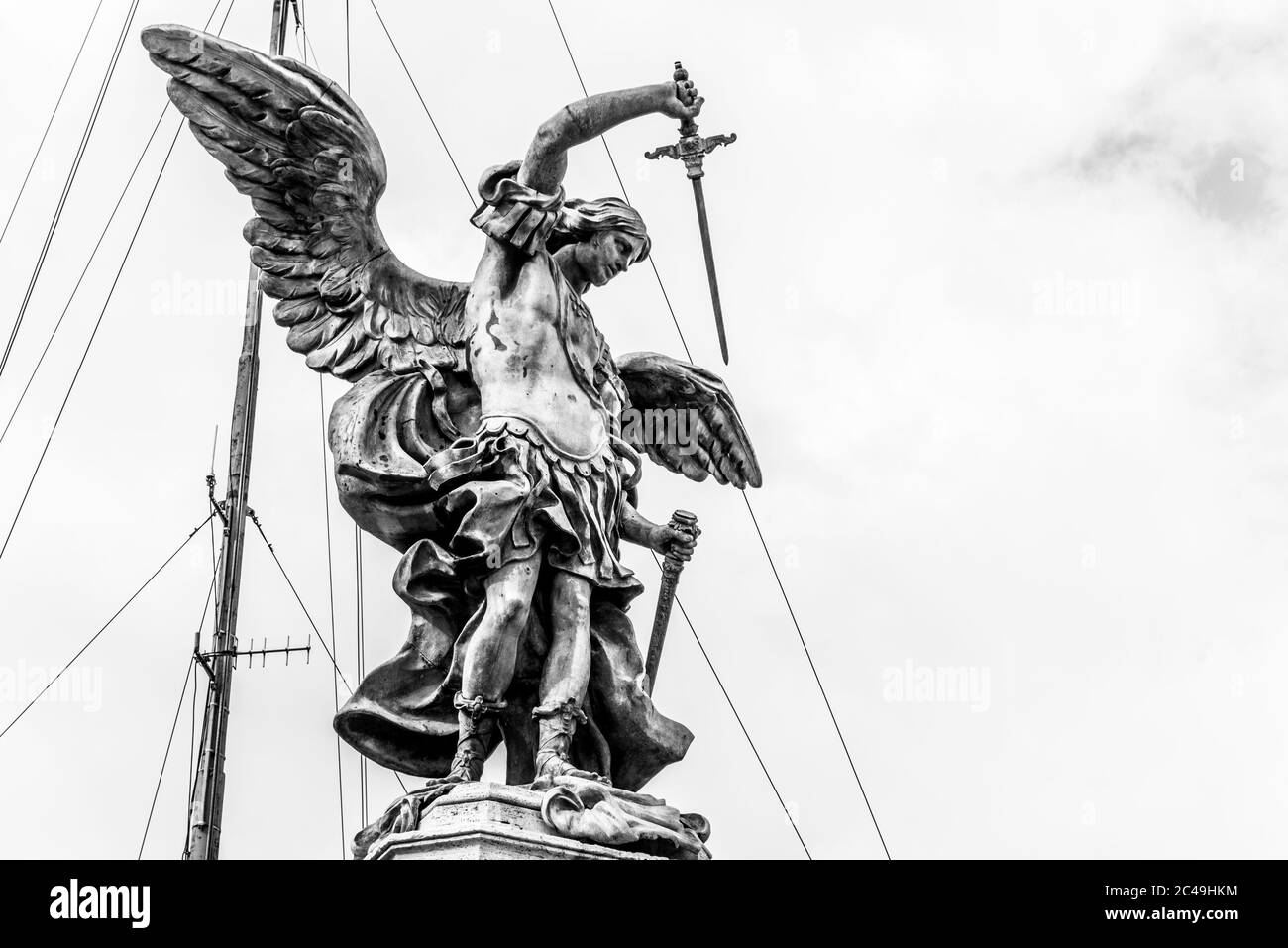 Bronze statue of Michael the Archangel on the top of the Castel Sant'Angelo, Rome, Italy. Black and white image. Stock Photo
