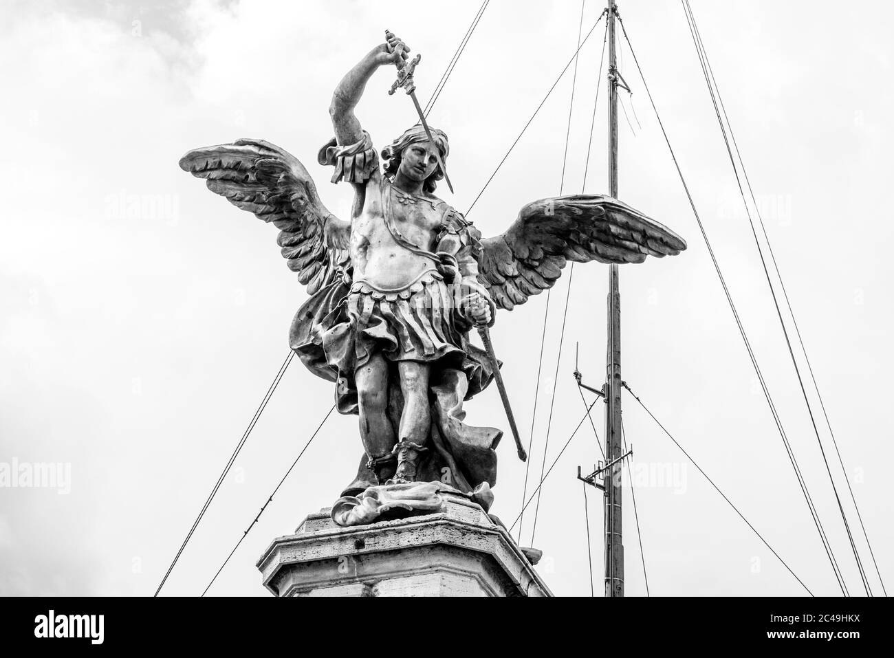 Bronze statue of Michael the Archangel on the top of the Castel Sant'Angelo, Rome, Italy. Black and white image. Stock Photo