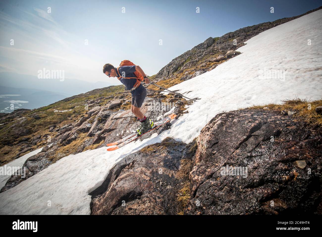 Andy Meldrum, owner of the Glencoe Mountain Resort, skis on some of the remaining snow patches on the slopes of Meall a'Bhuiridh in Glencoe as Thursday could be the UK's hottest day of the year with scorching temperatures forecast to rise even further. Stock Photo