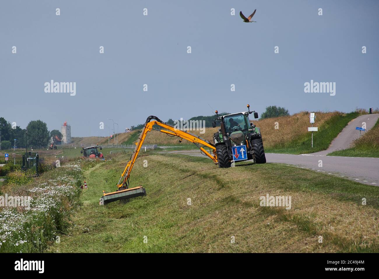 mowing road sides in Holland Stock Photo