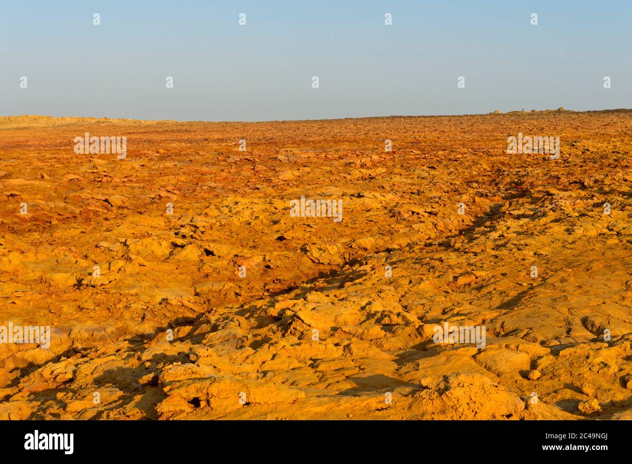 Red-brown volcanic earth with a high concentration of iron oxide in the Dallol geothermal area, Danakil Depression, Afar triangle, Ethiopia Stock Photo