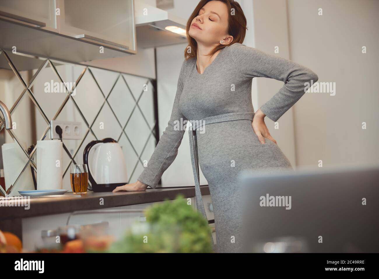 Tired pregnant woman feeling bad and closing her eyes Stock Photo Alamy
