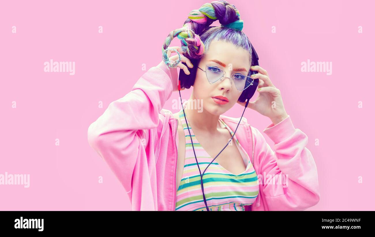 Cool funky teenage girl enjoy youth music on headphones Stock Photo