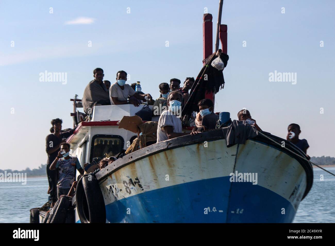 Aceh Utara, Indonesia. 25th June, 2020. A wooden boat seen 1 kilometre from the coast in North Aceh Regency carrying dozens of Rohingya people.According to local officials, as many as 94 Rohingyas were found by Acehnese fishermen stranded in the middle of the sea waters 1 kilometre from the coast off Aceh Province using wooden boats. Credit: SOPA Images Limited/Alamy Live News Stock Photo