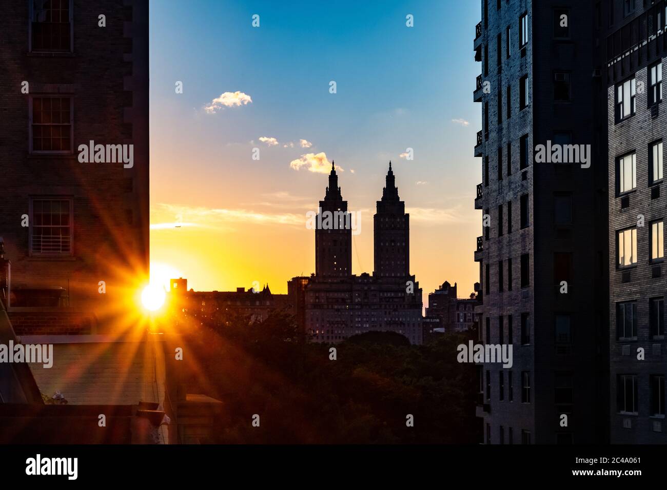 New York, USA, 24 June 2020. Sunset over the iconic towers of the San