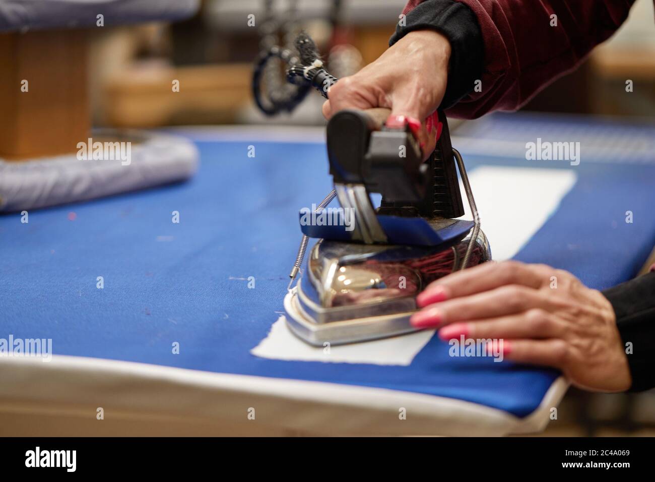 Ironing clothing industry hires stock photography and images Alamy