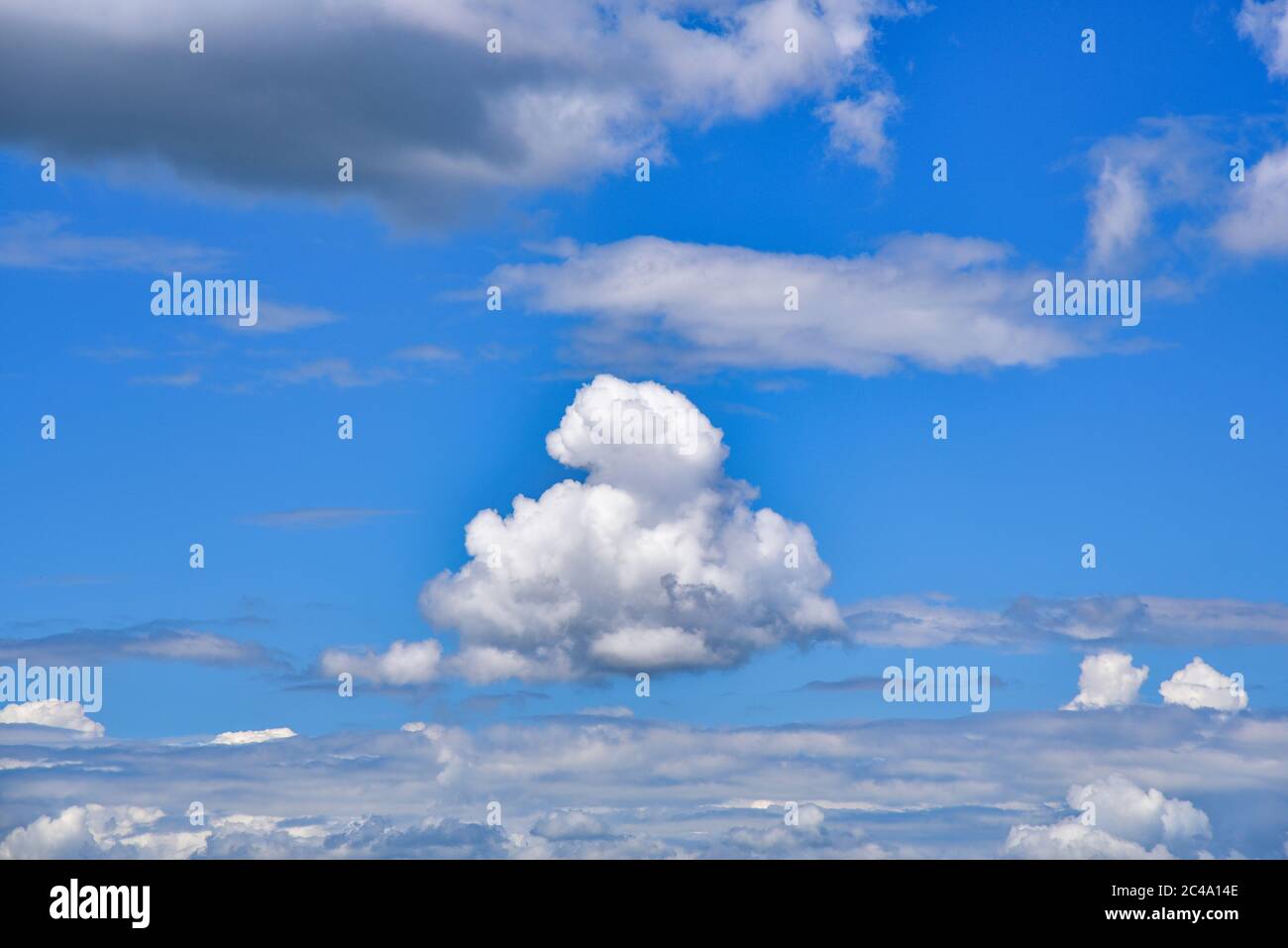 Single cumulus cloud in the blue sky, Bavaria, Germany, Europe Stock Photo