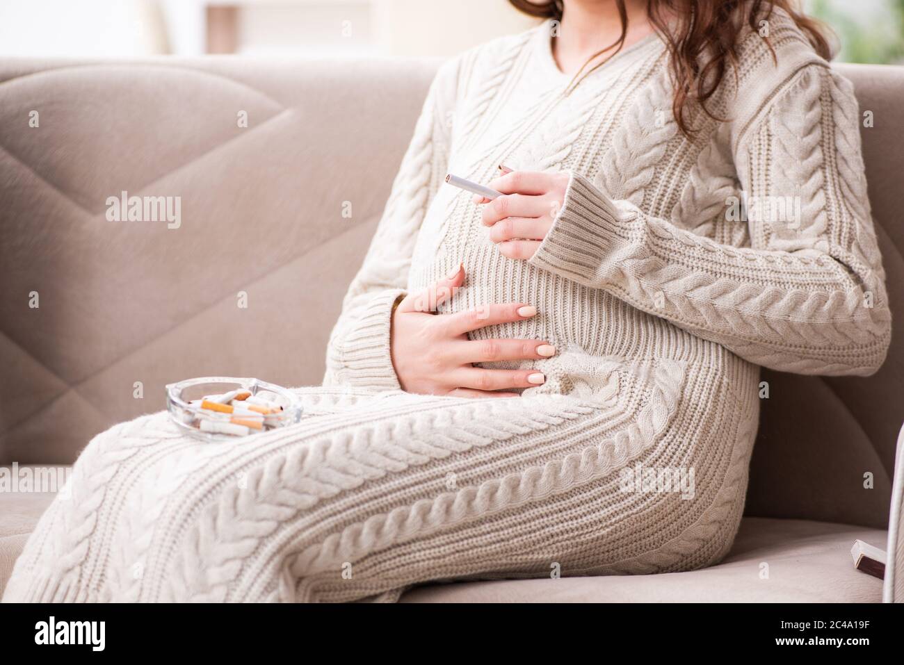 Man and pregnant woman in the antismoking concept Stock Photo