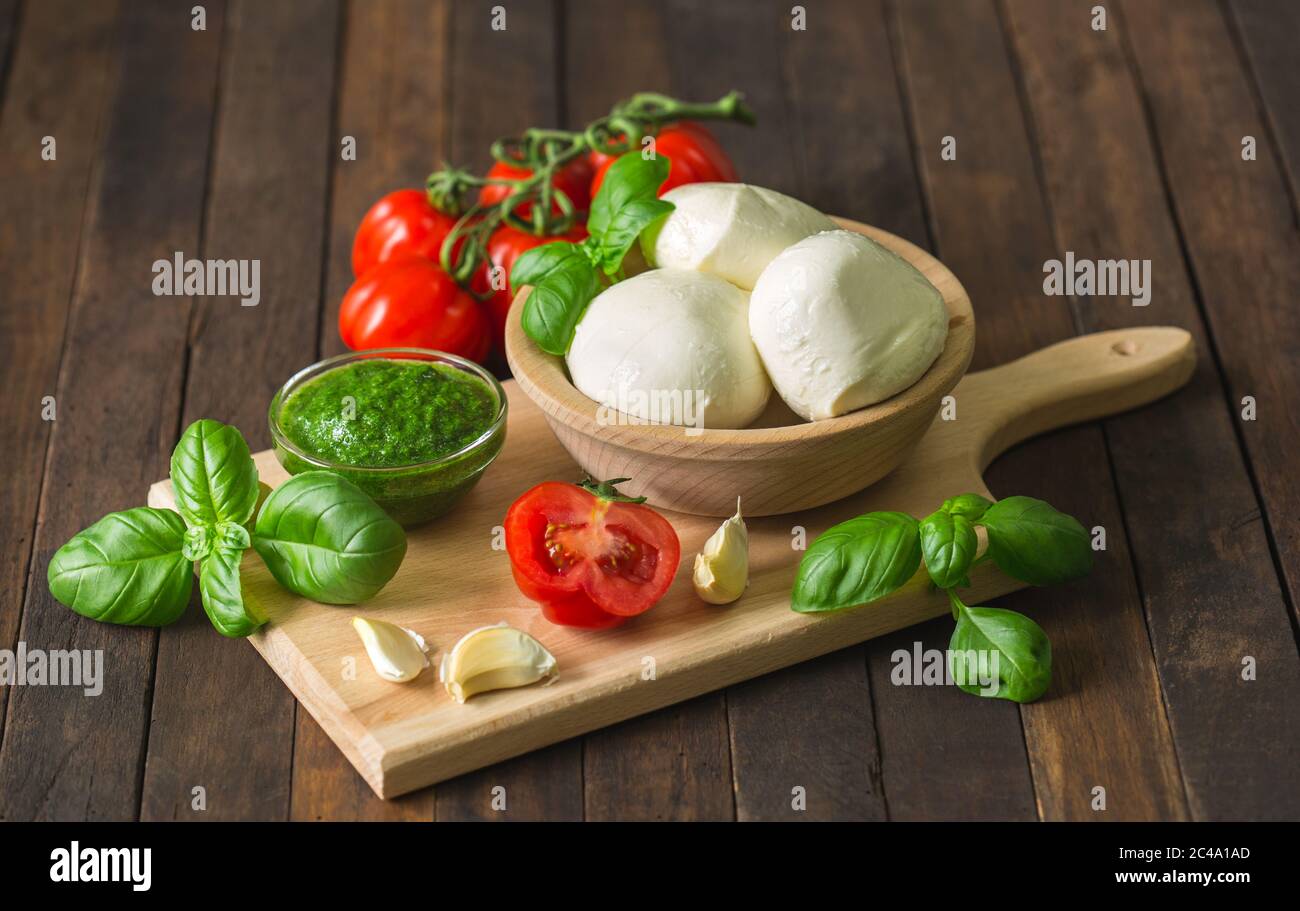 Fresh mozzarella cheese with basil and tomato Stock Photo