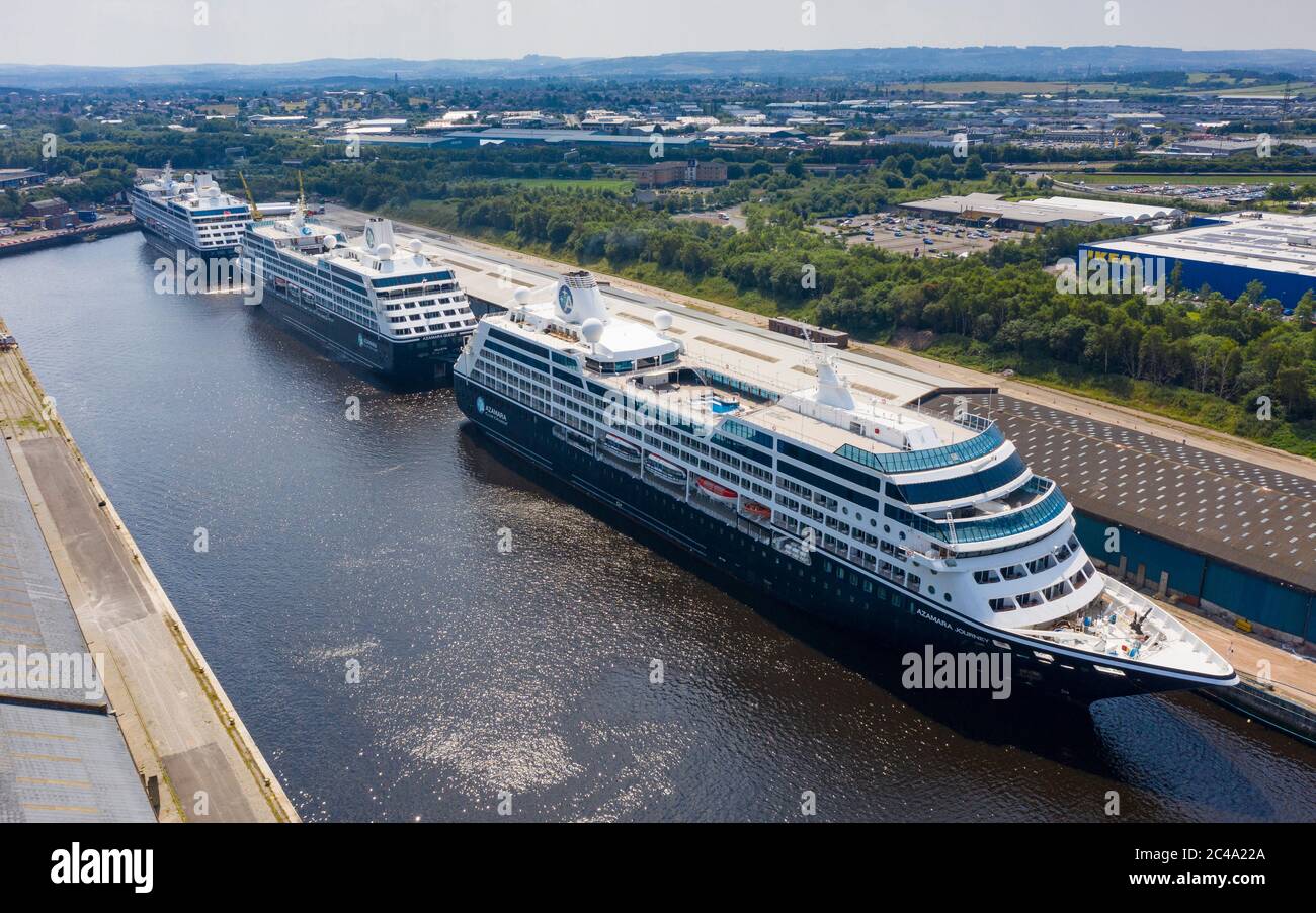 Glasgow, Scotland, UK. 25 June, 2020. Aerial view of the cruise ships Azamara Journey (nearest) and sister vessels, Azamara Quest (middle) and the Azamara Pursuit at King George V Docks on the Clyde in Glasgow. The ships are currently out of service due to the suspension of the cruise industry because of Covid-19 pandemic.  Iain Masterton/Alamy Live News Stock Photo