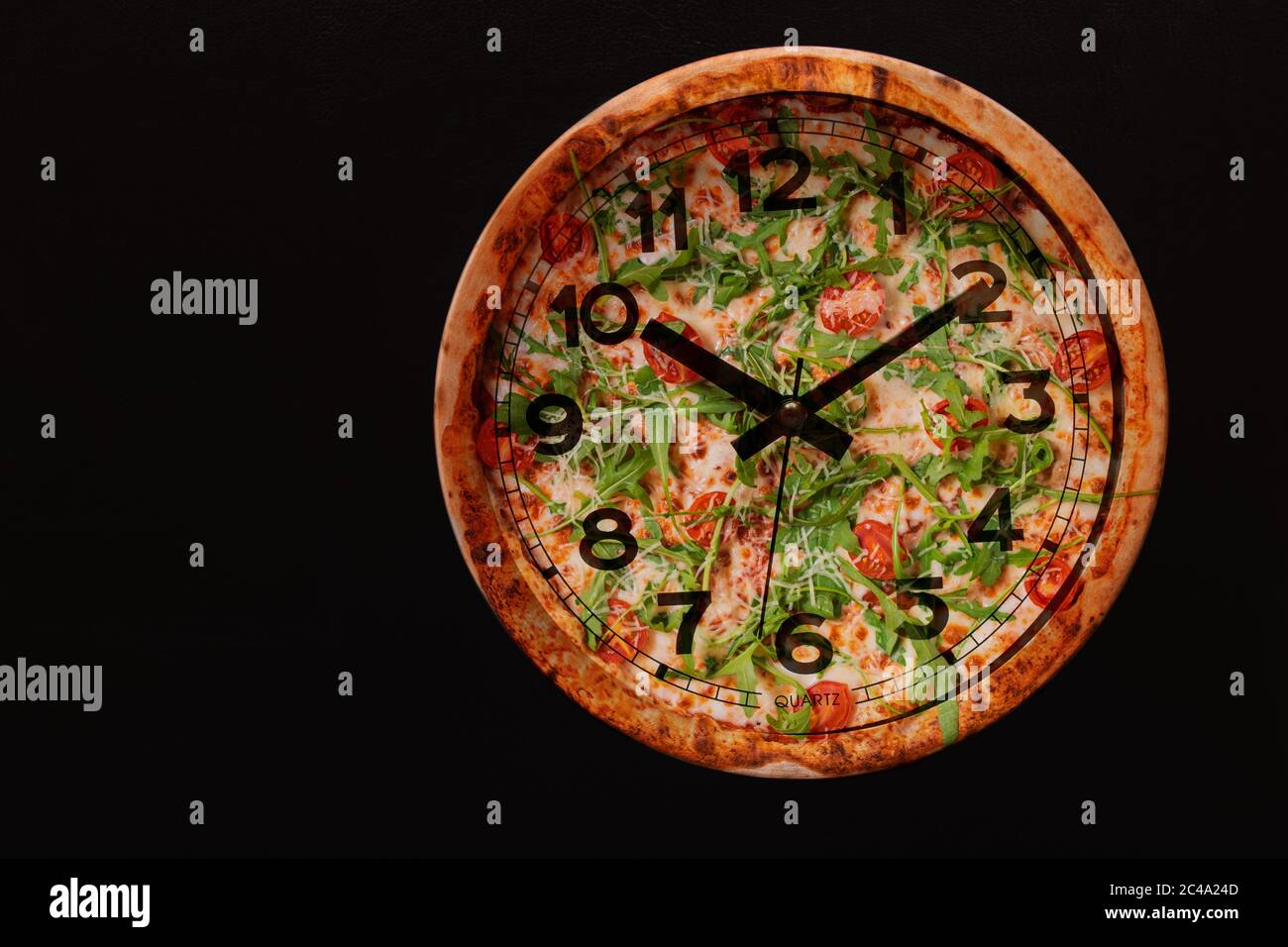 Pizza time in the form of a wall clock on a concrete background. Pizza clock. Place for text Stock Photo