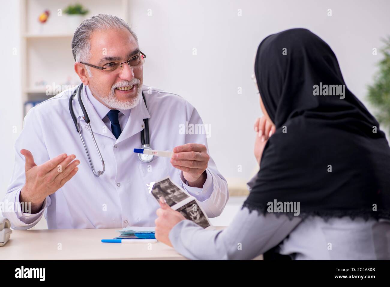 Arab woman visiting the experienced doctor Stock Photo Alamy