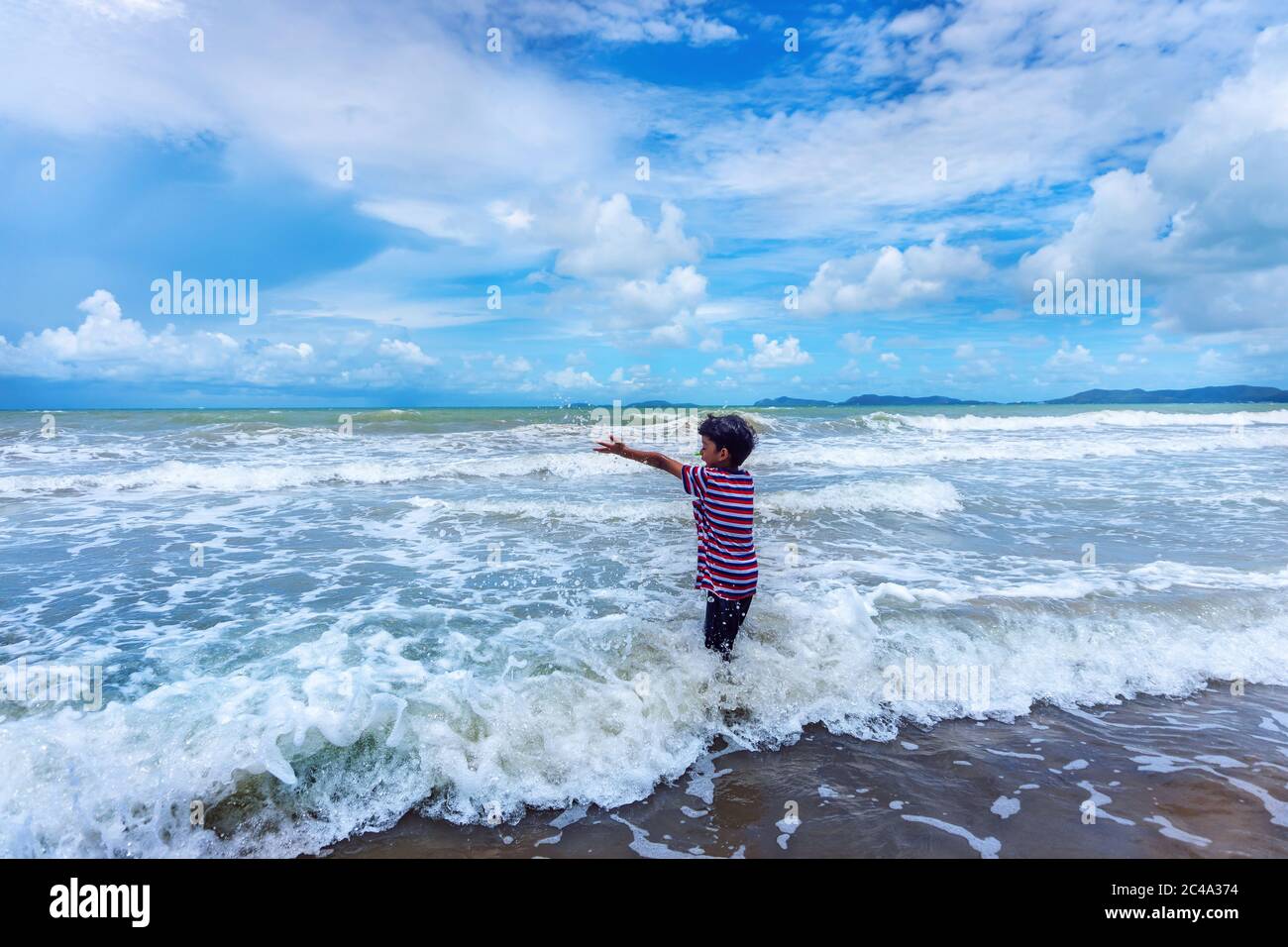 Happy asian family playing at the beach hi-res stock photography and ...