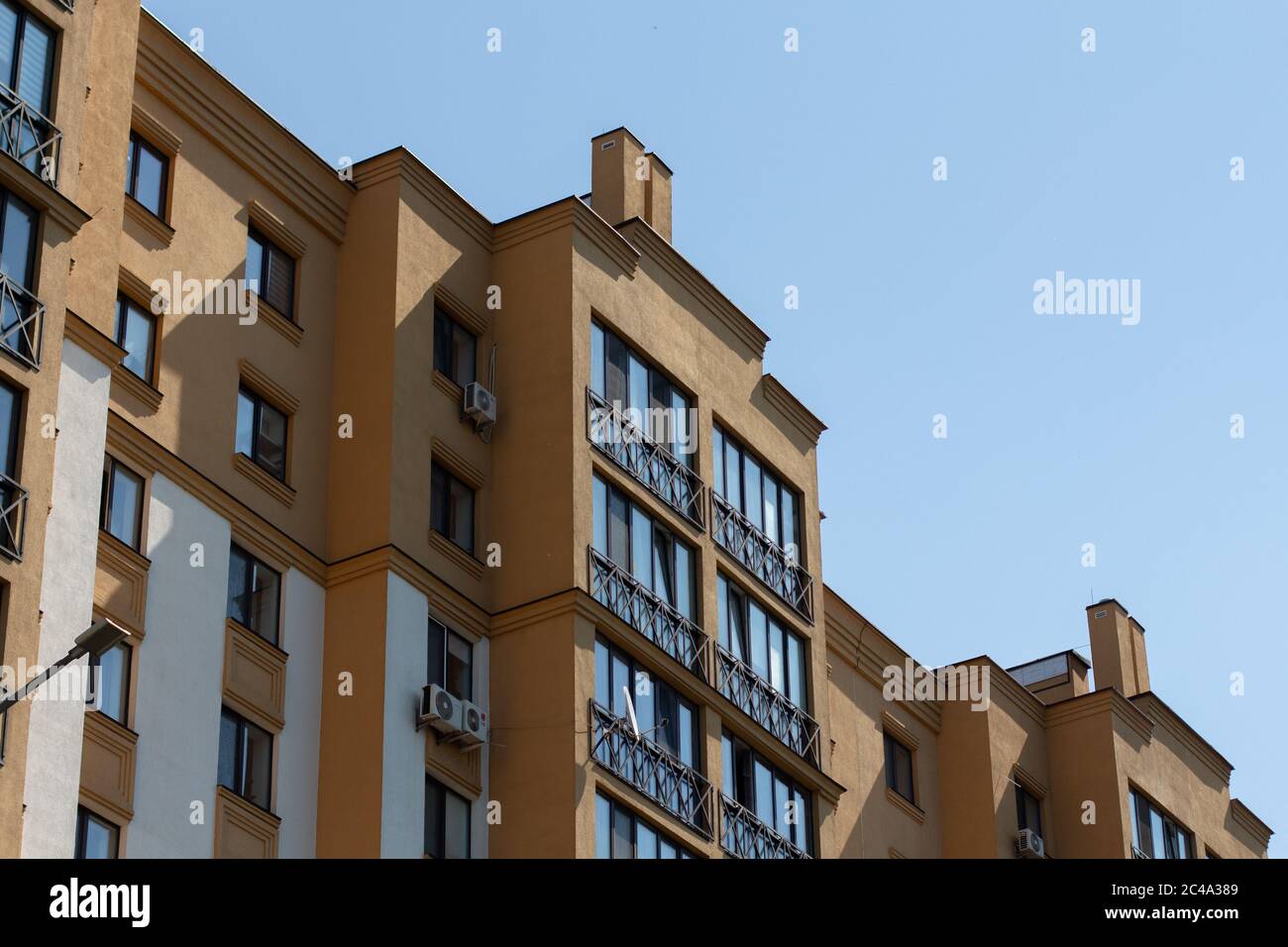 apartment building on background of blue sky Stock Photo - Alamy