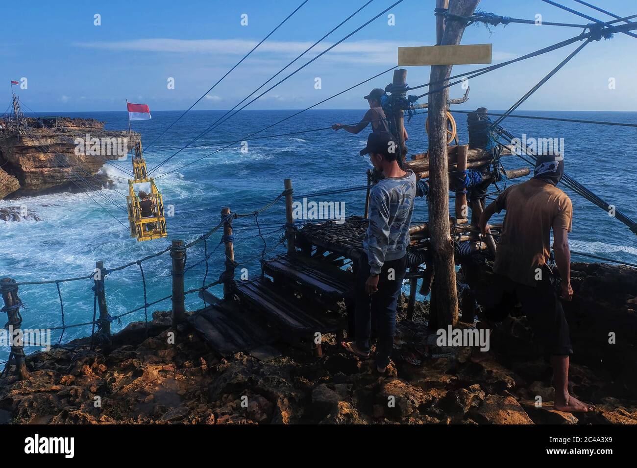 Timang, Yogyakarta: August 18th, 2017 - Group of man operating the ...
